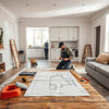 Contractor reviewing renovation plans in a modern home remodeling workspace