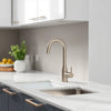Modern kitchen with a sleek premium faucet, matching sink, and refined finishes