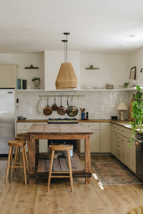 rustic kitchen with wooden island and stools