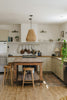 rustic kitchen with wooden island and stools