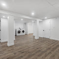 an empty room with a washer and dryer
