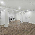 an empty room with a washer and dryer