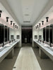 a large bathroom with sinks and mirrors