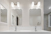 a bathroom with a couple of mirrors