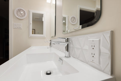 a bathroom with a sink and mirrors