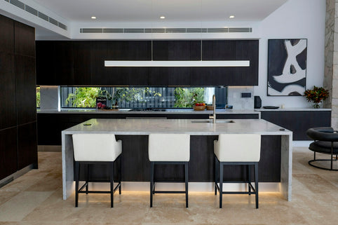 a kitchen with black cabinets