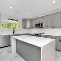 a kitchen with white cabinets