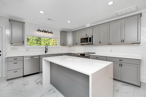 a kitchen with white cabinets