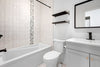 a bathroom with a tub toilet and sink