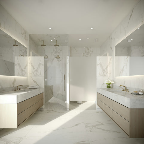 a large bathroom with marble counter tops and sinks