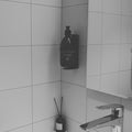 a black and white photo of a bathroom sink