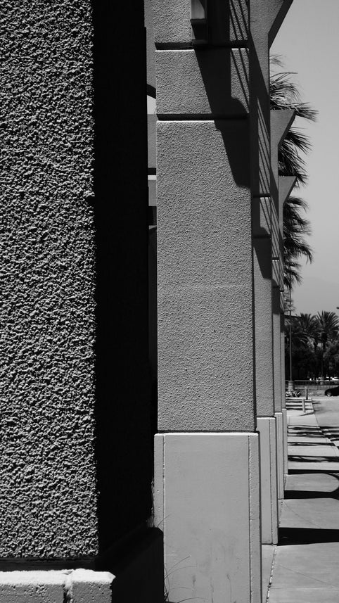A black and white photo of a stop sign