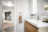 A bathroom with a sink and a mirror