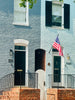 A brick building with a flag on the front of it
