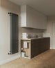 A kitchen with a radiator and a sink
