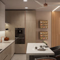 A modern kitchen with a small breakfast bar.