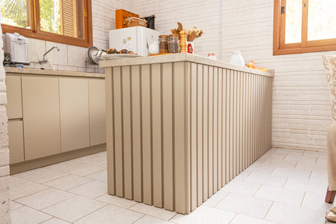A modern kitchen island with vertical paneling