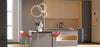 Modern kitchen island with bar stools and pendant lights.