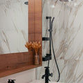 Modern bathroom with marble tile and black fixtures