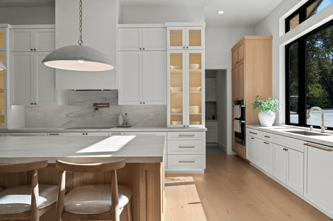 Modern white kitchen with island and large window