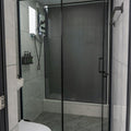 Modern bathroom with glass shower and toilet