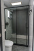 Modern bathroom with glass shower and toilet