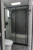 Modern bathroom with glass shower and toilet