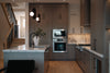 Modern kitchen with sleek gray cabinets and stainless steel appliances.