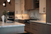 Modern kitchen with marble countertops and sleek cabinetry