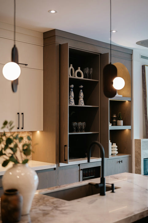 Modern kitchen island with sink and open shelving