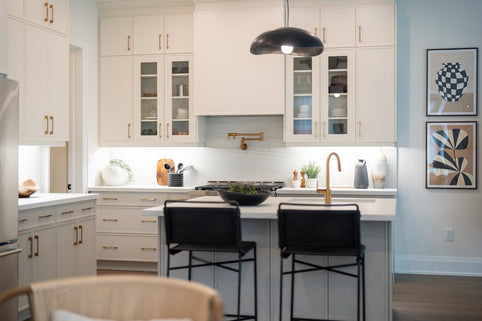 Modern white kitchen with island and bar stools