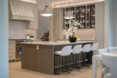 Modern kitchen island with white bar stools